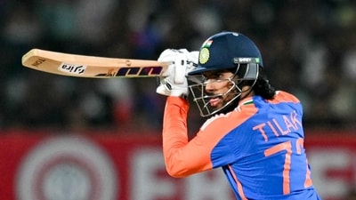 India's Tilak Varma plays a shot during the third Twenty20 international cricket match between India and England at the Niranjan Shah Stadium in Rajkot on January 28, 2025. (Photo by Money SHARMA / AFP) / -- IMAGE RESTRICTED TO EDITORIAL USE - STRICTLY NO COMMERCIAL USE -- (AFP) India's Tilak Varma plays a shot during the third Twenty20 international cricket match between India and England at the Niranjan Shah Stadium in Rajkot on January 28, 2025. (Photo by Money SHARMA / AFP) / -- IMAGE RESTRICTED TO EDITORIAL USE - STRICTLY NO COMMERCIAL USE -- (AFP)