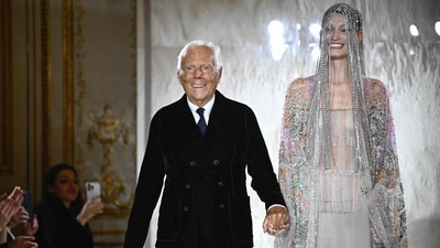 Italian designer Giorgio Armani acknowledges the applause at the end of his presentation for Armani Prive during the Women's Haute-Couture Spring/Summer 2025 Fashion Week. (AFP) Italian designer Giorgio Armani acknowledges the applause at the end of his presentation for Armani Prive during the Women's Haute-Couture Spring/Summer 2025 Fashion Week. (AFP)