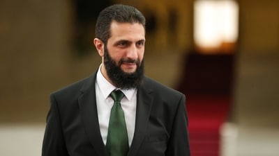 Sharaa has abandoned his nom de guerre Abu Mohammed al-Jolani, trimmed his beard and donned a suit and tie to receive foreign dignitaries. (AFP)