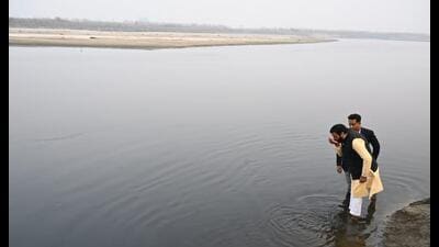 Haryana CM Nayab Singh Saini drinking water from Yamuna to demonstrate its ‘purity’ near Dahisara village on the Delhi-Haryana border on Wednesday. (Source: X) Haryana CM Nayab Singh Saini drinking water from Yamuna to demonstrate its ‘purity’ near Dahisara village on the Delhi-Haryana border on Wednesday. (Source: X)