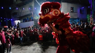 People of the Chinese community perform a dragon mask dance to welcome the Lunar New Year of the Snake, in Kolkata, India. (AP)