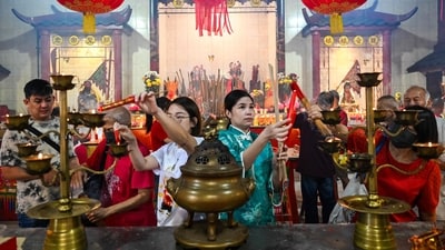 The Lunar New Year, popularly known as the Spring event in China, Tet in Vietnam, and Seollal in Korea, is an important festival observed throughout Asia. (Photo by Mohd RASFAN / AFP) (AFP) The Lunar New Year, popularly known as the Spring event in China, Tet in Vietnam, and Seollal in Korea, is an important festival observed throughout Asia. (Photo by Mohd RASFAN / AFP) (AFP)