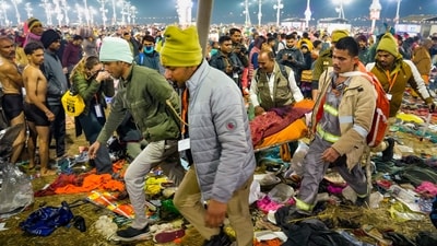Rescue personnel carry an injured devotee after a stampede broke out on Mauni Amavasya during the ongoing Mahakumbh Mela, at Sangam in Prayagraj. (PTI) Rescue personnel carry an injured devotee after a stampede broke out on Mauni Amavasya during the ongoing Mahakumbh Mela, at Sangam in Prayagraj. (PTI)