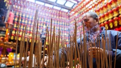 In Taiwan on Wednesday morning, people of all ages thronged temples across the island to make offerings of fruit, sweets, crackers and nuts, and mediate and pray. A man burns incense on the first day of the Lunar New Year of the Snake at a temple in Keelung, port city near Taipei, in northern Taiwan. on January 29, 2025. (AFP)