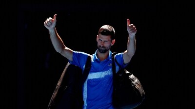 Serbia's Novak Djokovic gestures to the crowd as he leaves the court after retiring from his semi final match against Germany's Alexander Zverev (REUTERS)