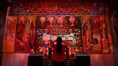 A woman offers prayers at the Hong San Koo Tee temple in Surabaya, Indonesian island of Java, on January 29, 2025, to mark the Lunar New Year of the Snake. 2025 marks the year of the Snake. The Chinese zodiac calendar is best described as a 12-year cycle represented by 12 different animals - Rat, Ox, Tiger, Rabbit, Dragon, Snake, Horse, Goat, Monkey, Rooster, Dog and Pig. This means that those born in 2025 will be snakes. In Chinese culture, snakes are considered both the symbols of harvest, procreation, spirituality, and good fortune, as well as cunning, evil, threat, and terror. (AFP)