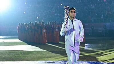 Uttarakhand badminton star Lakshya Sen carries the torch during the National Games opening ceremony in Dehradun on Tuesday. (ANI) Uttarakhand badminton star Lakshya Sen carries the torch during the National Games opening ceremony in Dehradun on Tuesday. (ANI)