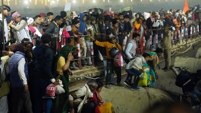 Devotees after a stampede occurred at Triveni Sangam on 'Mauni Amavasya' at the Maha Kumbh in Prayagraj on Wednesday. (PTI) Devotees after a stampede occurred at Triveni Sangam on 'Mauni Amavasya' at the Maha Kumbh in Prayagraj on Wednesday. (PTI)
