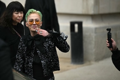 South Korean rap singer and songwriter Kwon Ji-Young, also known as G-Dragon (C) leaves after attending the Chanel Women's Haute-Couture show. (AFP) South Korean rap singer and songwriter Kwon Ji-Young, also known as G-Dragon (C) leaves after attending the Chanel Women's Haute-Couture show. (AFP)