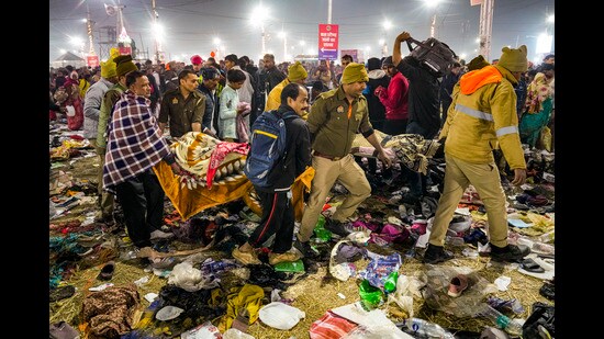 Rescue personnel carry an injured devotee after a "stampede-like" situation broke out on Mauni Amavasya during the ongoing Mahakumbh Mela, at Sangam in Prayagraj, Wednesday. (PTI)