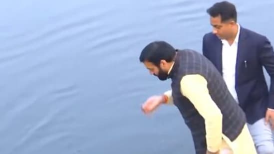 Haryana Chief Minister Nayab Singh Saini takes a sip of Yamuna water. (ANI) (ANI)