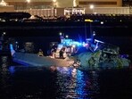 Emergency response units assess airplane wreckage in the Potomac River near Ronald Reagan Washington Airport Emergency response units assess airplane wreckage in the Potomac River near Ronald Reagan Washington Airport