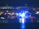 Part of the wreckage is seen as rescue boats search the waters of the Potomac River after a plane on approach to Reagan National Airport crashed into the river outside Washington, DC, January 30, 2025.(Photo by ANDREW CABALLERO-REYNOLDS / AFP) Part of the wreckage is seen as rescue boats search the waters of the Potomac River after a plane on approach to Reagan National Airport crashed into the river outside Washington, DC, January 30, 2025.(Photo by ANDREW CABALLERO-REYNOLDS / AFP)
