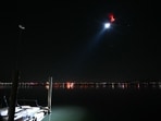 A search and rescue helicopter searches the water of the Potomac River after a passenger plane and helicopter collided near Washington's Reagon National Airport A search and rescue helicopter searches the water of the Potomac River after a passenger plane and helicopter collided near Washington's Reagon National Airport