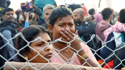 A devotee breaks down during a stampede before the 'Amrit Snan' on the occasion of Mauni Amavasya during the Mahakumbh 2025 in Prayagraj on Wednesday. (ANI) A devotee breaks down during a stampede before the 'Amrit Snan' on the occasion of Mauni Amavasya during the Mahakumbh 2025 in Prayagraj on Wednesday. (ANI)