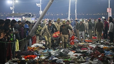 Security personnel carry an injured pilgrim at the site of a stampede amid the ongoing Maha Kumbh Mela festival in Prayagraj. (Arun Sankar/AFP) Security personnel carry an injured pilgrim at the site of a stampede amid the ongoing Maha Kumbh Mela festival in Prayagraj. (Arun Sankar/AFP)