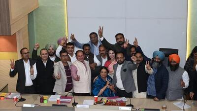 Newly elected mayor Harpreet Kaur Babla (seated, centre) with party councillors after the elections in the municipal corporation of Chandigarh on Thursday. (Ravi Kumar/HT)