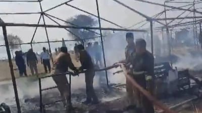 Fire department officers on-site using extinguishers to douse the blaze that erupted outside Sector 22 in the Maha Kumbh Mela area  on Thursday. (ANI)