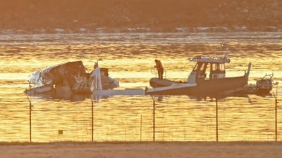 Part of the wreckage is seen as rescue boats search the waters of the Potomac River after a plane on approach to Reagan National Airport crashed into the river near Washington, DC, on January 30, 2025. (Photo by Andrew CABALLERO-REYNOLDS / AFP) (AFP) Part of the wreckage is seen as rescue boats search the waters of the Potomac River after a plane on approach to Reagan National Airport crashed into the river near Washington, DC, on January 30, 2025. (Photo by Andrew CABALLERO-REYNOLDS / AFP) (AFP)