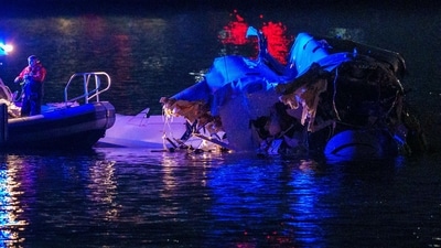 ARLINGTON, VIRGINIA - JANUARY 30: (EDITORS NOTE: Image contains graphic content) Emergency response teams including Washington, DC Fire and EMS, DC Police and others, assess airplane wreckage in the Potomac River near Ronald Reagan Washington Airport on January 30, 2025 in Arlington, Virginia. An American Airlines flight from Wichita, Kansas collided with a helicopter while approaching Ronald Reagan National Airport. Andrew Harnik/Getty Images/AFP (Photo by Andrew Harnik / GETTY IMAGES NORTH AMERICA / Getty Images via AFP) (Getty Images via AFP) ARLINGTON, VIRGINIA - JANUARY 30: (EDITORS NOTE: Image contains graphic content) Emergency response teams including Washington, DC Fire and EMS, DC Police and others, assess airplane wreckage in the Potomac River near Ronald Reagan Washington Airport on January 30, 2025 in Arlington, Virginia. An American Airlines flight from Wichita, Kansas collided with a helicopter while approaching Ronald Reagan National Airport. Andrew Harnik/Getty Images/AFP (Photo by Andrew Harnik / GETTY IMAGES NORTH AMERICA / Getty Images via AFP) (Getty Images via AFP)