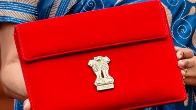 Union finance minister Nirmala Sitharaman carrying the Budget tablet wrapped in a traditional 'Bahi Khata' style pouch in Parliament. ( (ANI Photo)) Union finance minister Nirmala Sitharaman carrying the Budget tablet wrapped in a traditional 'Bahi Khata' style pouch in Parliament. ( (ANI Photo))