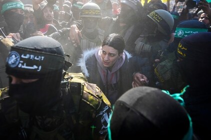 Israeli soldier Arbel Yehoud, 29, who has been held hostage by Hamas in Gaza since October 7, 2023, is escorted by Hamas and Islamic Jihad fighters as she is handed over to the Red Cross in Khan Younis, southern Gaza Strip, Thursday. (AP) Israeli soldier Arbel Yehoud, 29, who has been held hostage by Hamas in Gaza since October 7, 2023, is escorted by Hamas and Islamic Jihad fighters as she is handed over to the Red Cross in Khan Younis, southern Gaza Strip, Thursday. (AP)