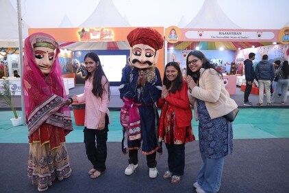 Visitors are not missing any chance to pose with artistes dressed as life-size Rajasthani puppets. (Photos: Manoj Verma/ HT )