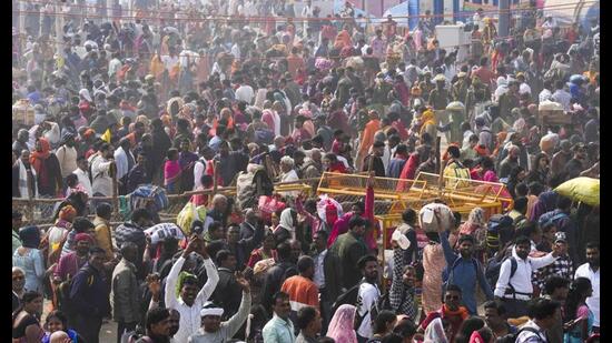 Devotees arrive to take a dip at Sangam during the ongoing Mahakumbh, in Prayagraj, Thursday. (PTI Photo)