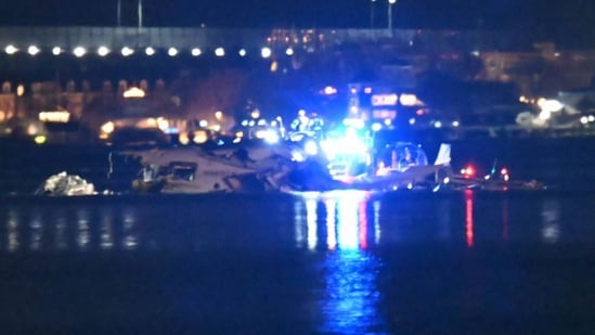 Part of the wreckage is seen as rescue boats search the waters of the Potomac River after a plane on approach to Reagan National Airport crashed into the river outside Washington, DC, January 30, 2025.(Photo by ANDREW CABALLERO-REYNOLDS / AFP) (AFP)