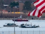 Washington DC plane crash: A diving team and police boat is seen around a wreckage site in the Potomac River from Ronald Reagan Washington National Airport, Thursday, Jan. 30, 2025, in Arlington, Va. (AP Photo/Jose Luis Magana) Washington DC plane crash: A diving team and police boat is seen around a wreckage site in the Potomac River from Ronald Reagan Washington National Airport, Thursday, Jan. 30, 2025, in Arlington, Va. (AP Photo/Jose Luis Magana)