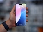 FILE PHOTO: FILE PHOTO: A man holds an Apple iPhone 16 Pro Max ahead of the launch of sales of the new iPhone 16 series smartphones in a store in Moscow, Russia September 20, 2024. REUTERS/Evgenia Novozhenina/File Photo/File Photo