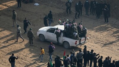 Freed prisoner Zakaria Zubeidi, a former high-profile commander of the Fatah group's Al Aqsa Martyrs Brigades,was escorted with great fanfare as people watched on (Raneena Sawafta/REUTERS)