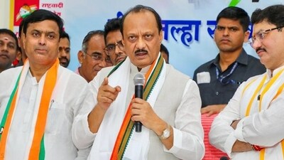 In his maiden tour of Beed district as guardian minister, Ajit Pawar (centre) warned party workers, controlled by Dhananjay Munde (right), of serious action if found involved in any law-breaking activities In his maiden tour of Beed district as guardian minister, Ajit Pawar (centre) warned party workers, controlled by Dhananjay Munde (right), of serious action if found involved in any law-breaking activities