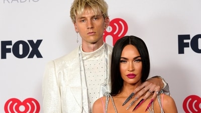 Megan Fox is negotiating custody terms with Machine Gun Kelly before their child's birth, insisting on full custody and support.  (AP Photo/Chris Pizzello, File) (Chris Pizzello/Invision/AP)