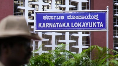 A policeman stands guard at the Lokayukta office, in Bengaluru, Karnataka. (PTI) A policeman stands guard at the Lokayukta office, in Bengaluru, Karnataka. (PTI)