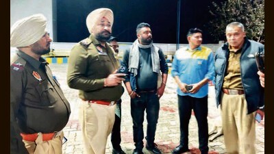 Police at the spot after robbery at a filling station in Machhiwara, Ludhiana, on Friday. (HT Photo)