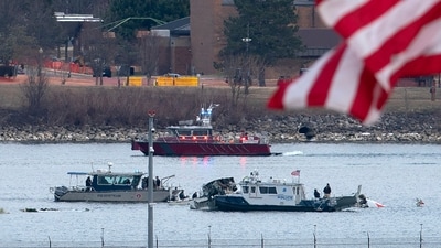 Washington DC plane crash: A diving team and police boat is seen around a wreckage site in the Potomac River from Ronald Reagan Washington National Airport, Thursday, Jan. 30, 2025, in Arlington, Va. (AP Photo/Jose Luis Magana) (AP) Washington DC plane crash: A diving team and police boat is seen around a wreckage site in the Potomac River from Ronald Reagan Washington National Airport, Thursday, Jan. 30, 2025, in Arlington, Va. (AP Photo/Jose Luis Magana) (AP)