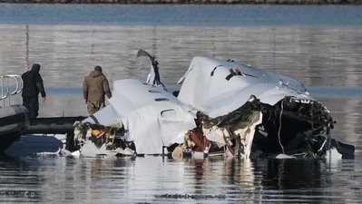 One of the "black box" recorders from aircraft AA5342 has been found by authorities in the Potomac River. The device, which contains voice recorders from the cockpit and flight data, will be a crucial piece of evidence for determining what transpired during the journey. (AFP)