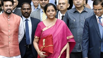 For the 2019 budget, the finance minister wore a simple pink saree with thick golden border. (Ajay Aggarwal/HT PHOTO) For the 2019 budget, the finance minister wore a simple pink saree with thick golden border. (Ajay Aggarwal/HT PHOTO)
