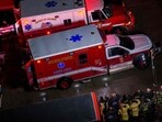  First responders salute the flag draped bodies of service members killed in a midair collision depart a temporary emergency disaster site at Buzzard Point 
