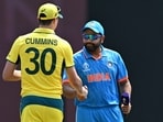 Australia's captain Pat Cummins (L) and India's captain Rohit Sharma shake hands Australia's captain Pat Cummins (L) and India's captain Rohit Sharma shake hands
