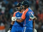 India's Shivam Dube (R) celebrates with his teammate Axar Patel after scoring a half-century (50 runs) during the fourth T20I.
