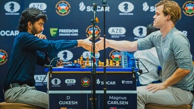 D Gukesh and Magnus Carlsen after a game. D Gukesh and Magnus Carlsen after a game.