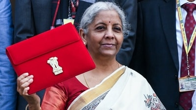 Union Finance Minister Nirmala Sitharaman shows the Budget Tablet as she arrives at Parliament House to present the Union Budget 2025. (ANI) Union Finance Minister Nirmala Sitharaman shows the Budget Tablet as she arrives at Parliament House to present the Union Budget 2025. (ANI)