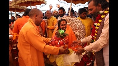 Chief minister Yogi Adityanath attends a meeting organised for the ‘pattabhishek’ of two revered sadhus in Sector 22 of Mahakumbh Mela area on Saturday. (Sourced)