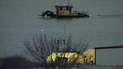 Emergency vehicles are seen across the Potomac River near Ronald Reagan Washington National Airport, Friday, Jan. 31, 2025, in Washington. (AP Photo/Carolyn Kaster) Emergency vehicles are seen across the Potomac River near Ronald Reagan Washington National Airport, Friday, Jan. 31, 2025, in Washington. (AP Photo/Carolyn Kaster)