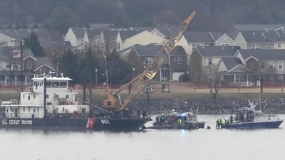 Searchers can be seen sifting through the debris of a fatal midair accident between the airline and an Army helicopter in the Potomac River. (AP Photo/Alex Brandon) Searchers can be seen sifting through the debris of a fatal midair accident between the airline and an Army helicopter in the Potomac River. (AP Photo/Alex Brandon)