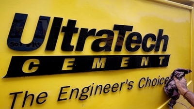 A man cleans an Expert Testing Van of UltraTech Cement outside a cement store in Ahmedabad. (Amit Dave/Reuters)