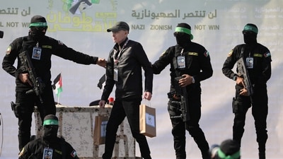 Israel and US flags were seen waved high as Hamas released American-Israeli Keith Siegel on Saturday. Ge crossed the border from Gaza after being handed over by Hamas to the Red Cross at a ceremony in Gaza City.&nbsp; (Reuters)