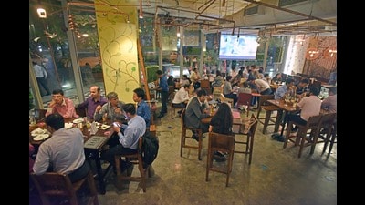Mumbai, India - May 25, 2017: Office goers having food and drink together at Dishkiyaoon, BKC in Mumbai, India, on Thursday, May 25, 2017. (Photo by Pratik Chorge/Hindustan Times) (Pratik Chorge/HT Photo) Mumbai, India - May 25, 2017: Office goers having food and drink together at Dishkiyaoon, BKC in Mumbai, India, on Thursday, May 25, 2017. (Photo by Pratik Chorge/Hindustan Times) (Pratik Chorge/HT Photo)